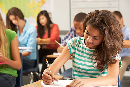 Student taking notes