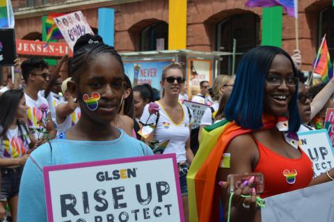 Two students at a pride parade. 